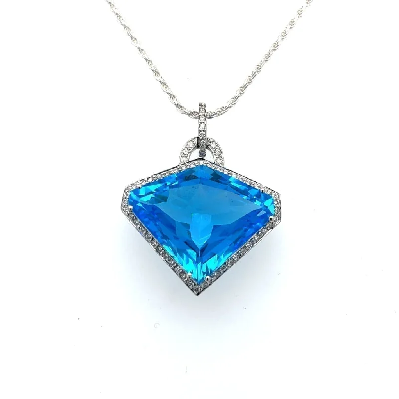 Shield Cut Blue Topaz Set in a 14k White Gold Pendant with Accent Diamonds at Regard Jewelry in